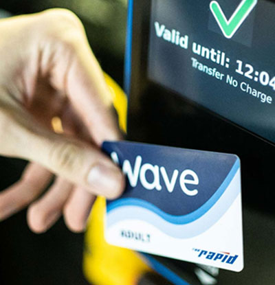 The Wave fare card in front of the card reader
